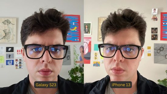 Samsung Galaxy S23 review photo comparison showing the S23 on the left and iPhone on the right, with identical pictures. They are both photos of a man with big, thick-rimmed glasses looking at a camera, with black hair against a background of posters.