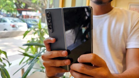 Samsung Galaxy Z Fold 4 Review - a photo of the reviewer holding the phone in both hands