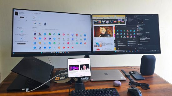 Samsung Galaxy Z Fold 4 Review - a photo of the phone connected to a PC with two monitors behind it showing apps, the Pocket Tactics website, and more