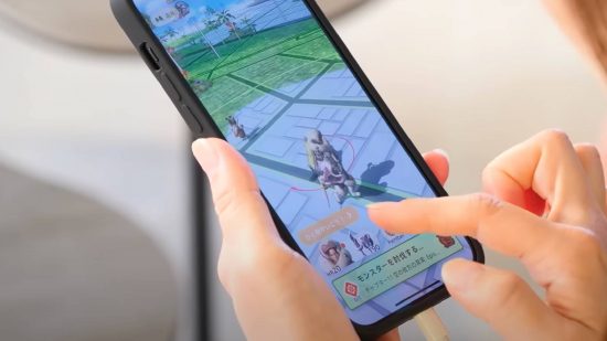 Monster Hunter Now interview: A player taps their fingers on a phone