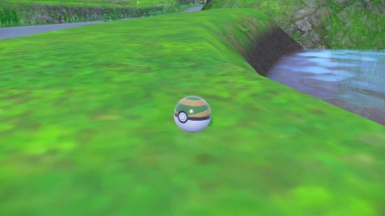 Pokemon Scarlet and Violet The Teal Mask review: a pokeball sits on a grassy wall