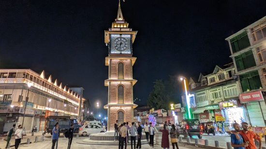 Picture of a tower at night with people below taken on the Google Pixel 7a for a review of the phone