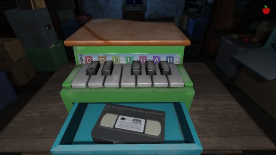 Amanda the Adventurer Switch review - a screenshot of a toy piano with a tape in the drawer