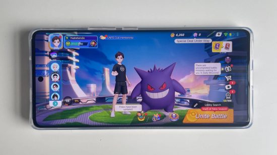 Infinix Zero 30 5G review: The Infinix Zero 30 5G is laid flat on a table, with a screenshot from Pokemon Unite visible on the screen