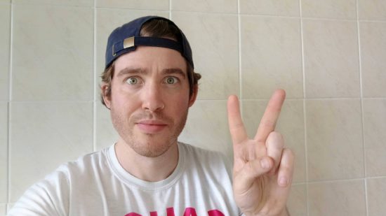 Infinix Zero 30 5G review: a selfie taken from the front facing Infinix Zero 30 5G camera shows a white man in his thirties doing a peace sign, his eyes are tired, and for some reason he has a backwards baseball cap and a nose piercing, things normally associated with people half his age