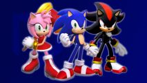 Three Sonic characters, Amy, Sonic, and Shadow, stood in front of a dark blue background