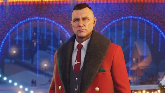 Vinnie Jones in World of Tanks wearing a red coat, and stood in front of fairy lights