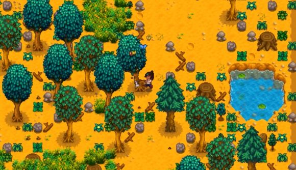 Best farm games: Stardew Valley. Image shows a person cutting down a tree.