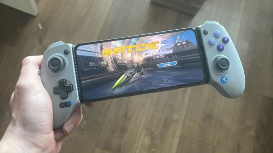 Custom image of the reviewer holding the GameSir G8 Galileo with Riptide GP 2 on screen for a review of the device