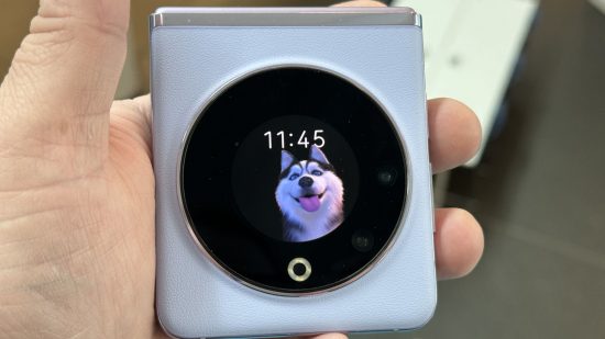 Close up of the display on a Tecno Phantom V Flip with a cute dog animation for a review of the phone