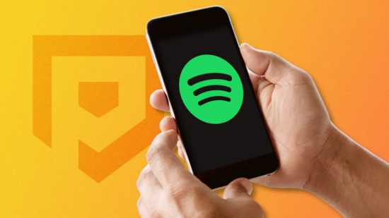 How to cancel Spotify - two hands holding a phone with the Spotify logo on the screen