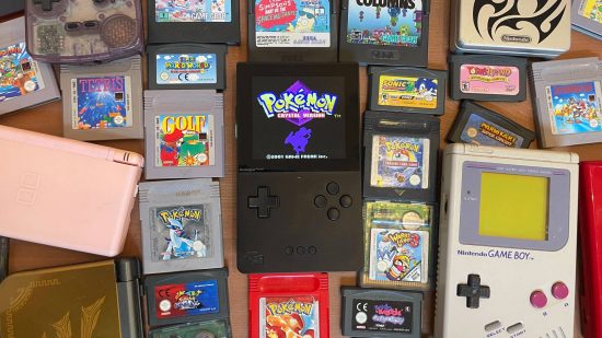 Super Pocket review - the Analogue Pocket sitting amongst a selection of Game Boy cartridges