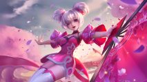 How to play Honor of Kings: Xiao Qiao from Honor of Kings, a pink-themed female character with space buns and a traditional Chinese-inspired outfit. She is wielding a pink fan and sakura petals are floating around her