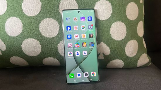 Image for the for Tecno Spark 20 Pro+ review with the device resting against a green and white pillow