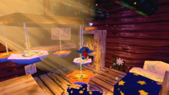 Cavern of Dreams Switch review - Fynn the dragon jumping across platforms in a bedroom with a bed in the corner