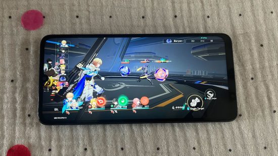 Custom image of the Poco C65 running a battle in Honkai Star Rail for a review of the phone