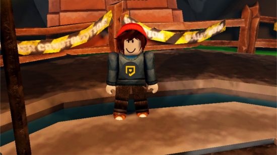 An avatar stood in a blue PT jumper with a red beanier in front of caution tape and wooden stairs