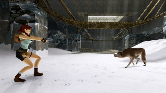 Lara Croft in a snowy tomb aiming her guns at a wolf