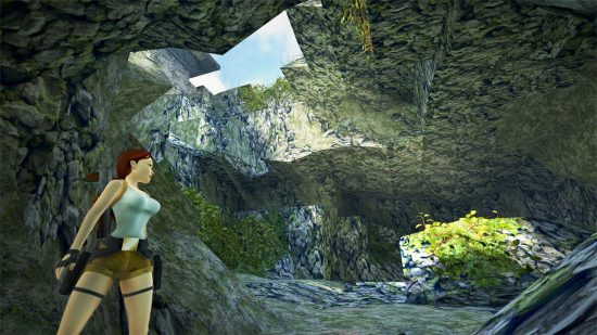 Lara Croft in a forest tomb looking at a crack in the roof with the sun pouring in