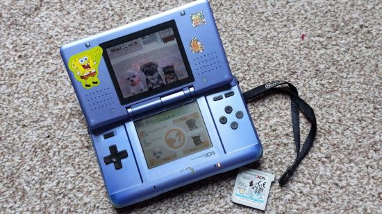 Nintendogs feature - a blue DS console covered in stickers