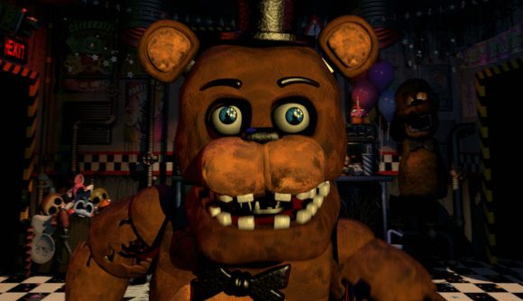 FNAF movie opinions: Freddy in his top hat performing a jumpscare n a dark room with checkered flooring