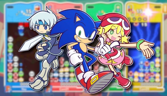 Puyo Puyo PUzzle Pop release date: Two Puyo characters flanking Sonic, all outlined in white and pasted on a blurred screenshot of the new game's multiplayer mode