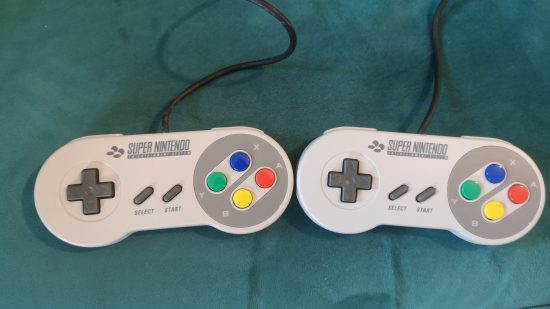 Super NES Classic Edition review image showing its two controllers.