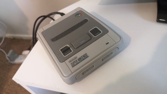 Super NES Classic Edition review image showing the console on a TV table.