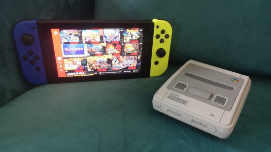 Super NES Classic Edition review image showing the console besides a Nintendo Switch running the NSO SNES app.