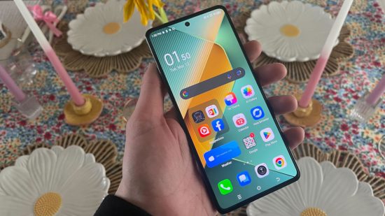 Custom image for TECNO POVA 6 Pro 5G review with the reviewer holding the phone in hand