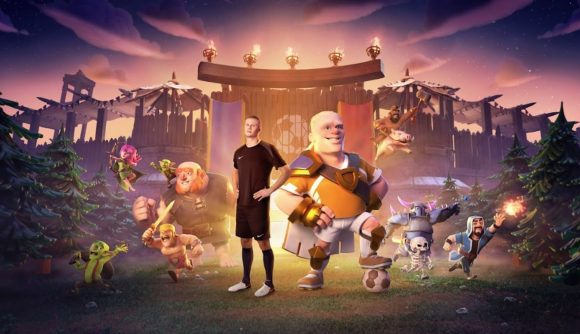 Man City striker Erling Haaland stands with his pixelated alter-ego the Barbarian King, in Clash of Clans collab