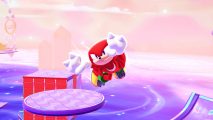 Knuckles flying through a Sonic Dream Team Sweet Dreams level with a cloudy background and platforms around him