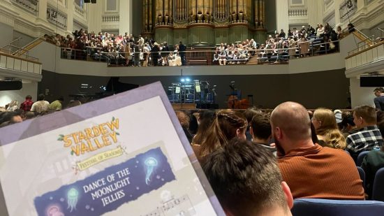 Photo taken at the Stardew Valley concert, Stardew Valley: Festival of Seasons, with the Dance of the Moonlight Jellies sheet music in shot