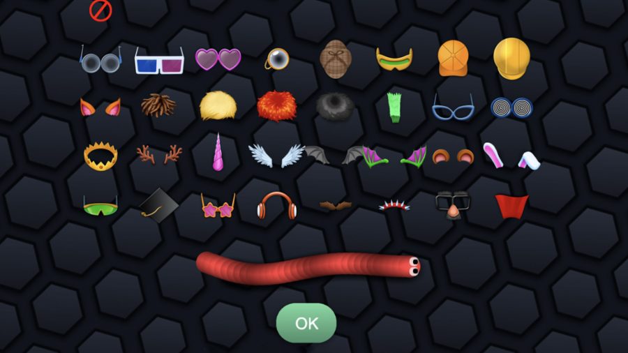 A snake in slither.io with a selection of cosmetics above ranging from glasses to hair to capes