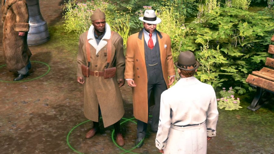 Al Capone and one of this associates talking to a man in a white coat in a park. Capone is chewing on a cigar.