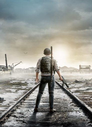 A PUBG Mobile character standing on train tracks