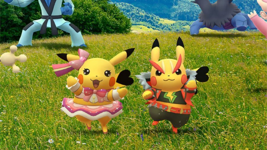 Two Pikachu, one is wearing a tutu and the other is in a jacket and pants