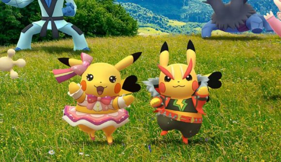 two pikachu, one is wearing a tu tu and the other is in a jacket and pants