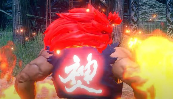 Akuma from Street Fighter stands victoriously while the pattern on his outfit glows