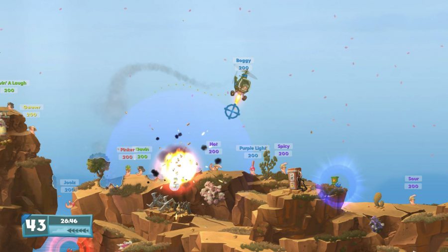 A worm character is controlling a helicopter and devastating other players below 