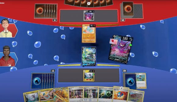A top down perspective shows a match of the Pokemon Trading Card Game