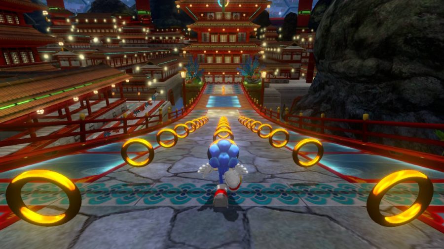 Sonic stands at the top of a steep hill, with dozens of rings in front of him