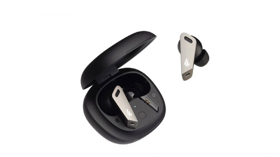 Black and grey wireless earbuds are displayed, with one placed in the black charging cradle and another shown separately