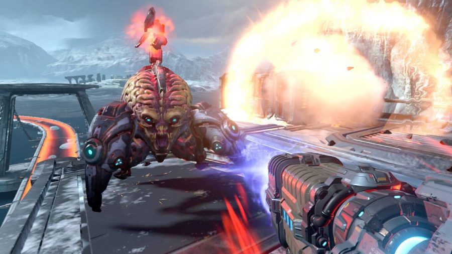 A player points a large weapon at an enemy, the enemy looks like a giant crab brain on legs 
