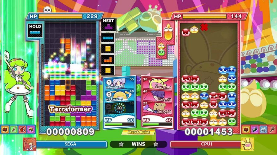 two different puzzles games are playing competitively, one side playing Tetris and the other playing PuyoPuyo 