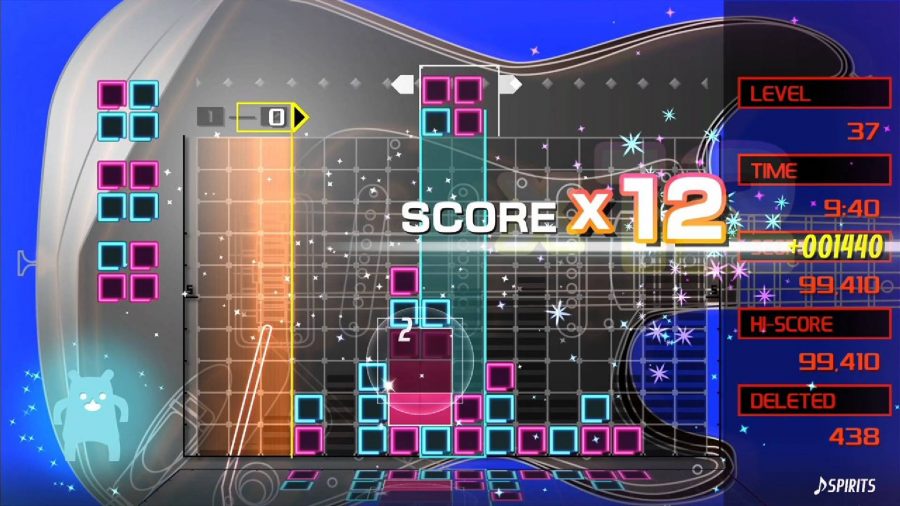 Blocks fall and a score is displayed, the blocks are very colourful and energetic 