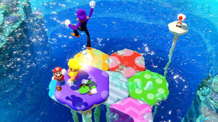 Four players fight to stay above water, as several multicolour platforms lower and rise