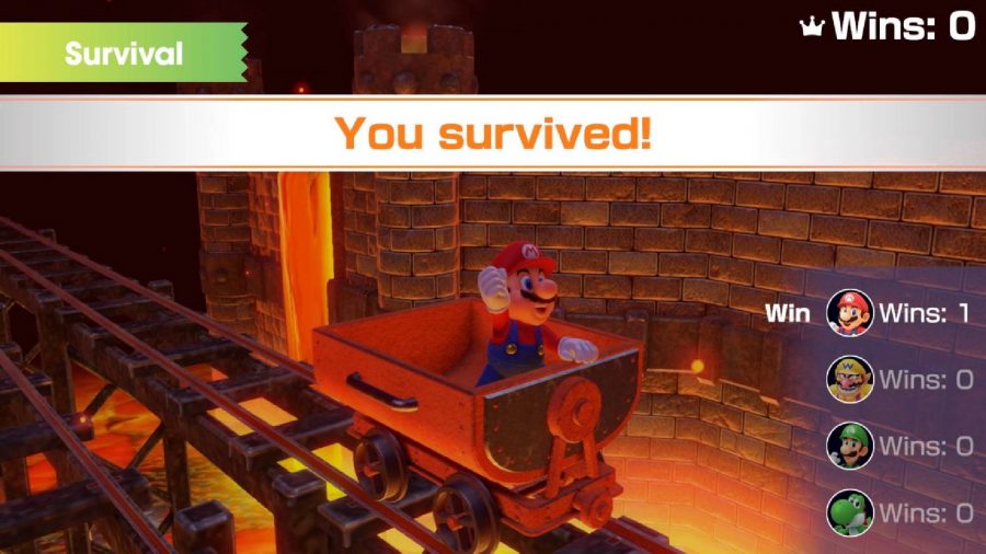 Mario sits in a cart with his hand help up in victory, the screen reads "You survived!"