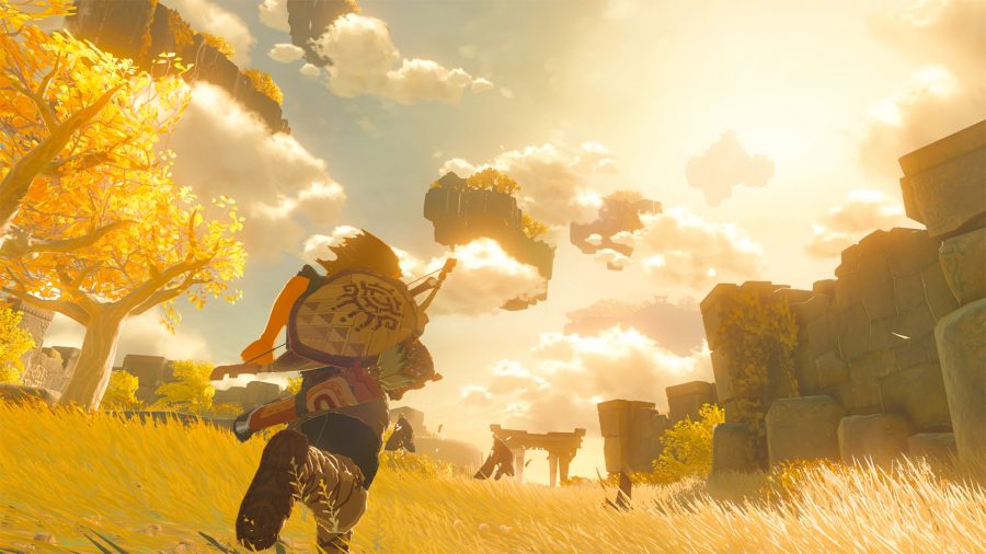 Link from Breath of the Wild runs through a large open area, atop a floating island, while golden light shines through the clouds 