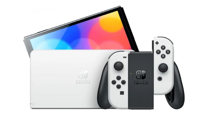 A white Nintendo Switch OLED model coming out of it's dock